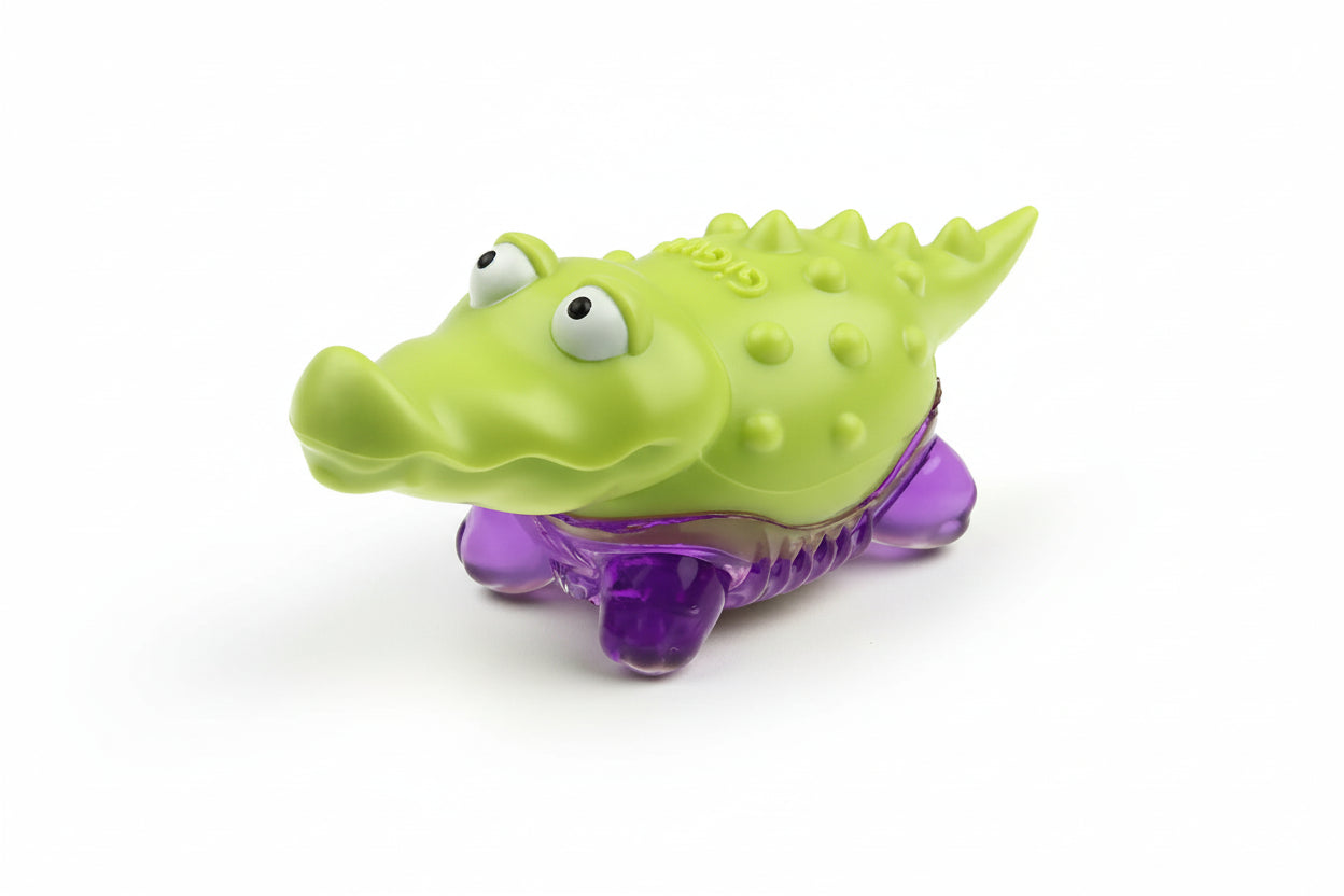 Green and purple alligator toy on a white background