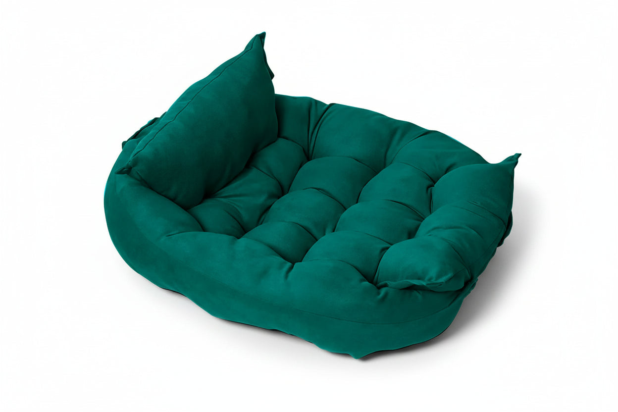Green pet bed with a pillow on a white background